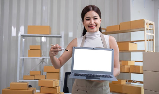 Business owner presenting a laptop screen with listings of online businesses for sale