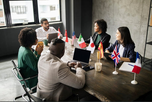 Business people connecting across countries with international flags on the table, 2025 global business collaboration