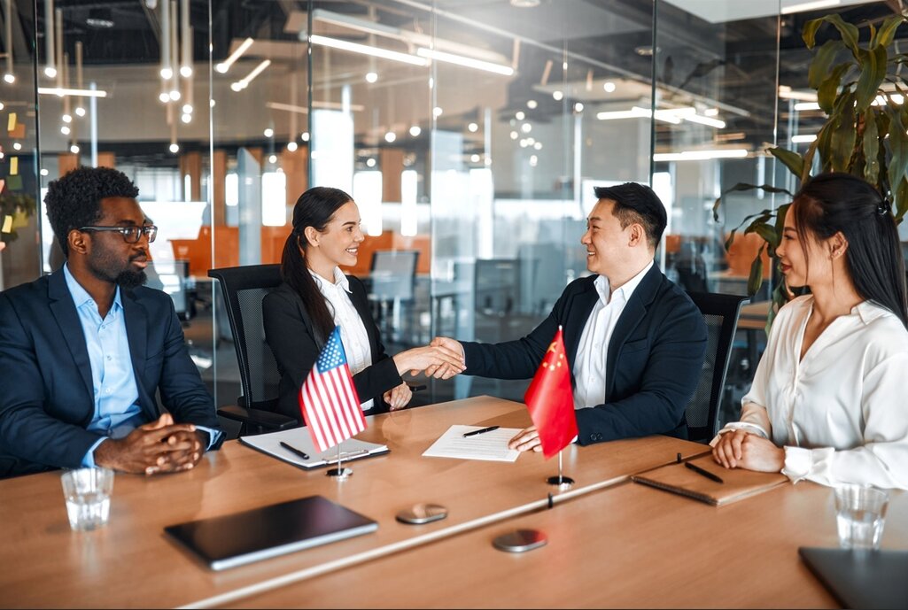 Business professionals negotiating international deals in an office, symbolic of buying world businesses