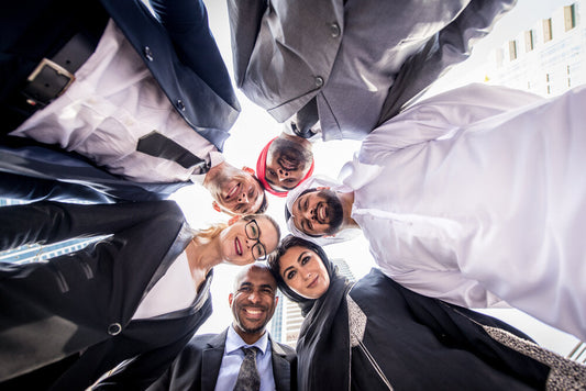 Business team in Dubai discussing international acquisitions – Top 5 platforms to buy a business worldwide