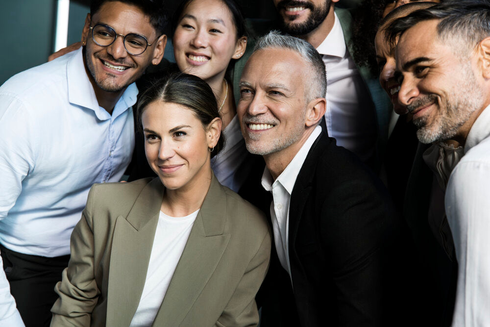 Multiracial group of successful business people discussing how to sell a business globally in 2025