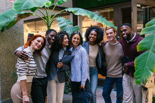 Smiling multiethnic business team standing together, representing global collaboration and success — Explore Opportunities at World Businesses For Sale