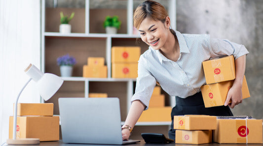 Young Asian female entrepreneur researching businesses for sale online in 2025, representing SME business ownership trends.