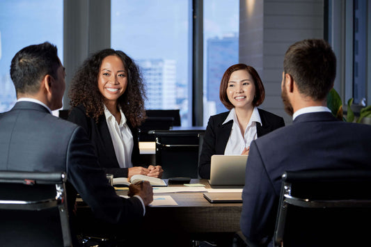 Business owner shaking hands with buyer after successful business sale negotiation