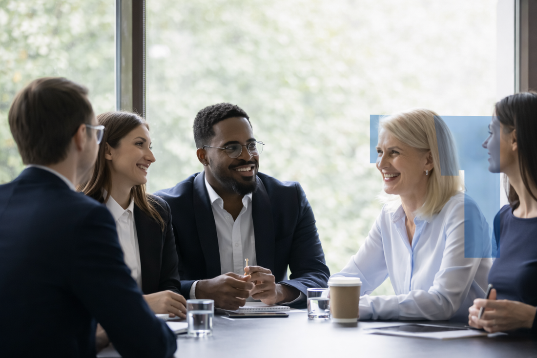 Business professionals meeting in modern office discussing company services around conference table