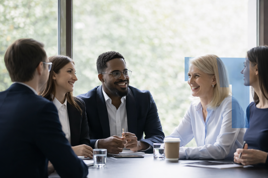 Business professionals meeting in modern office discussing company services around conference table