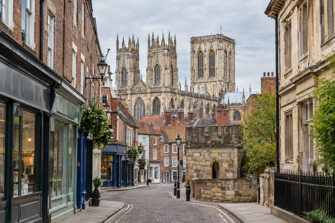 York Minster rising above historic city centre buildings and local shopfronts.