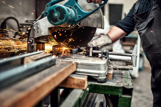 Metal fabrication workshop in Canada with CNC machines, welding stations, and skilled staff producing precision components.